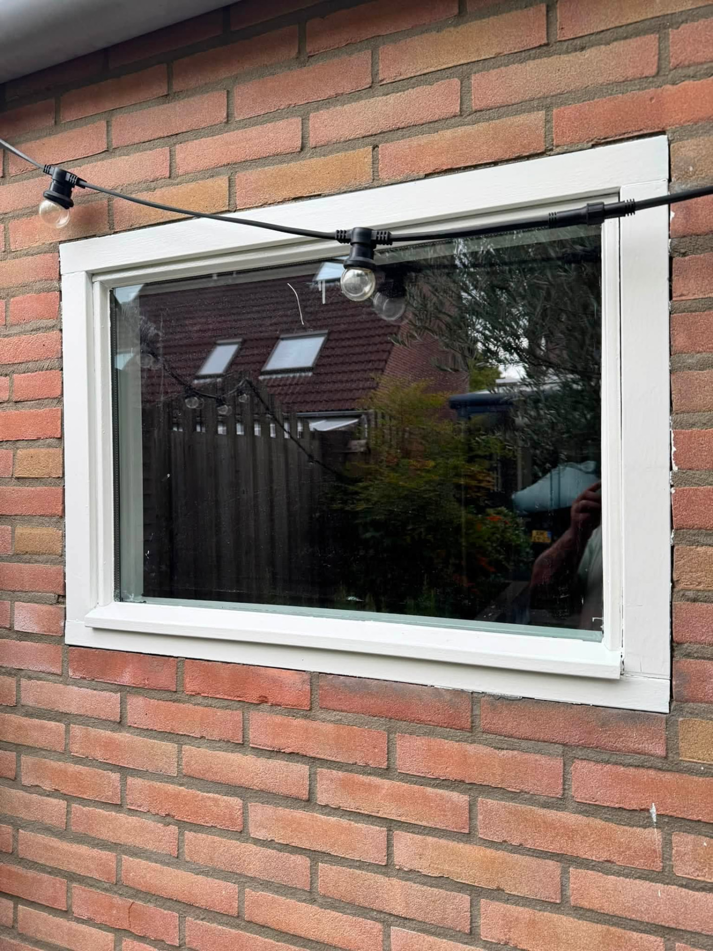 Raam repareren aan de tuinzijde